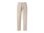 Light beige sweatpants with a drawstring waist and side pockets.