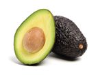 Avocados: one halved, one whole.