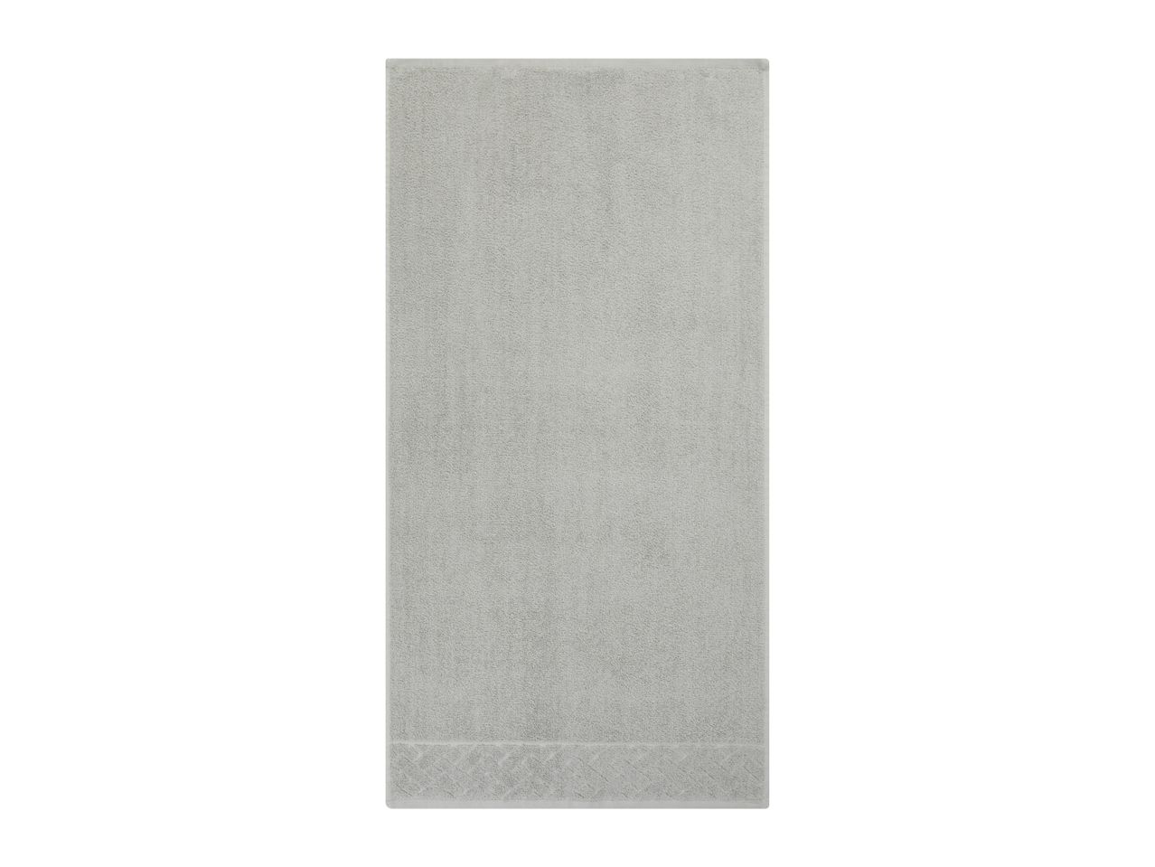 A light gray, textured rectangular tile.