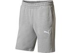 Gray Puma sweat shorts with an elastic waistband and white logo.