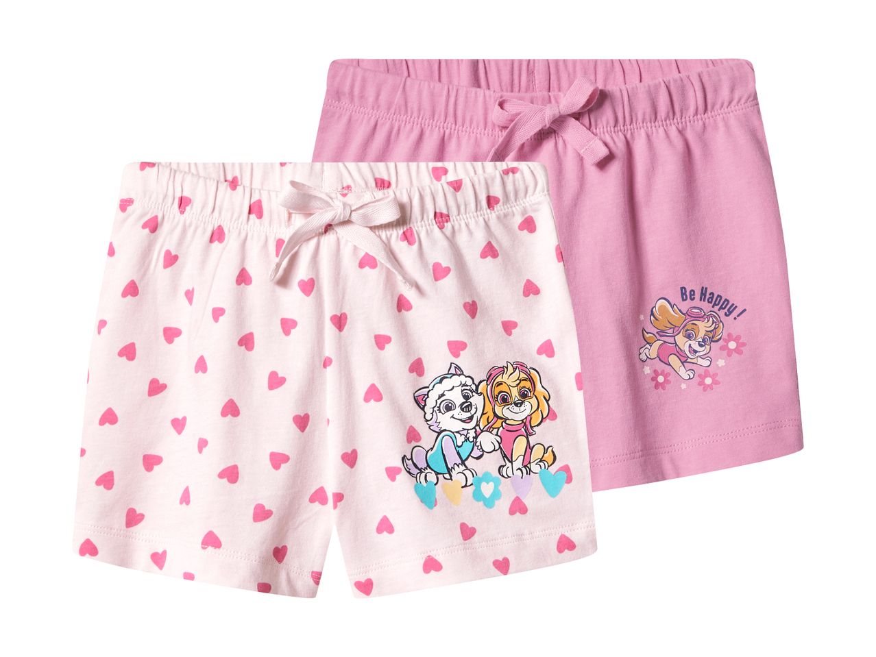 To par lyserøde shorts til piger, det ene med hjerter og tegneseriehunde, det andet med teksten 'Be Happy!'.