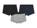 Drei Herren-Boxershorts in Schwarz, Dunkelblau und Grau liegen übereinander.