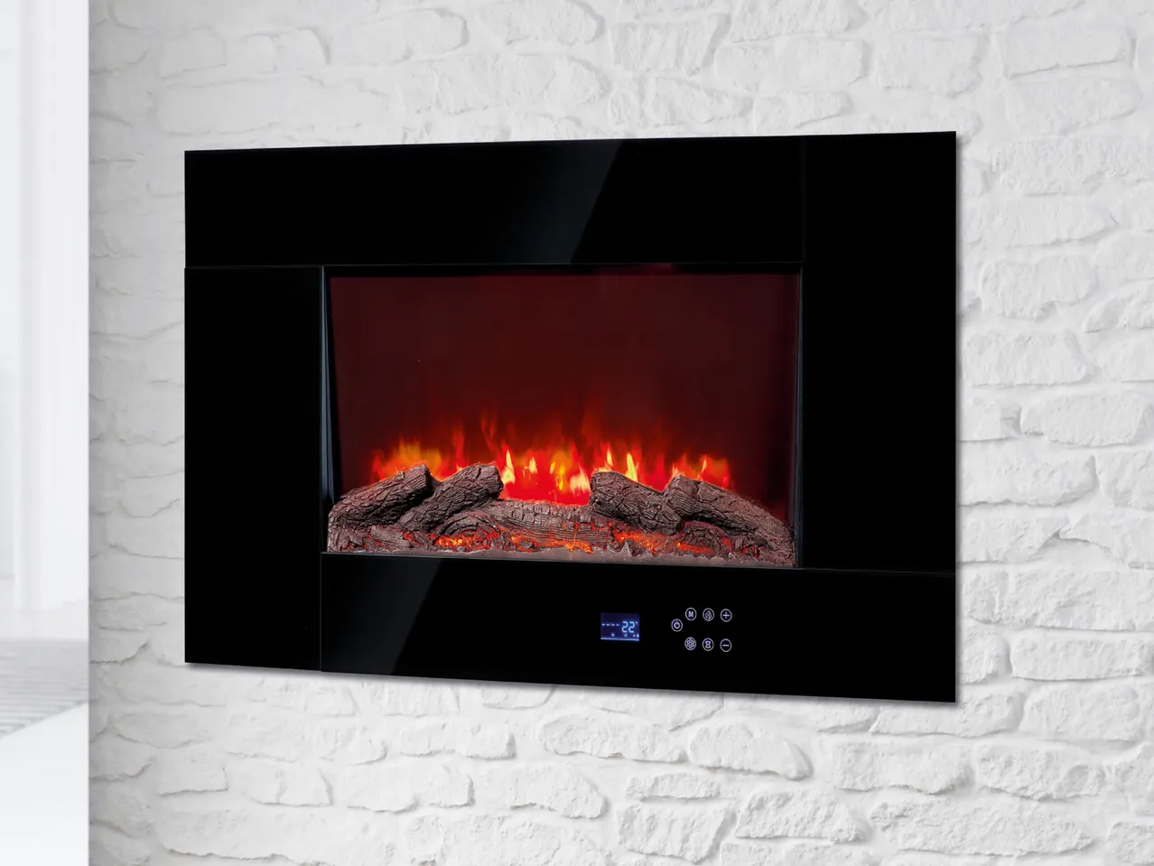 Wall-mounted electric fireplace with black frame and glowing logs on a white brick wall.