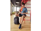 Man in Crivit sportswear with a black Crivit sports bag and orange towel.