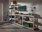 Garage shelving unit with various tools, storage boxes, and a step ladder.