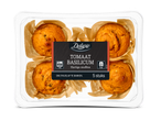 Verpakking met 5 hartige muffins met tomaat en basilicum, klaar om af te bakken.