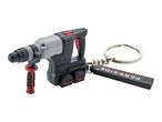 A miniature hammer drill keychain with a black and grey body, red accents, and a branded tag.