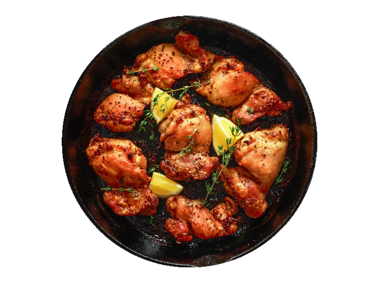 Cepti vistas gabaliņi ar citronu un timiānu čuguna pannā.