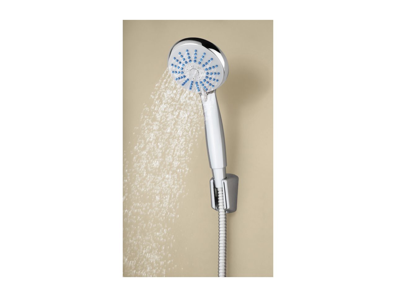 A chrome shower head with blue nozzles spraying water against a beige wall.