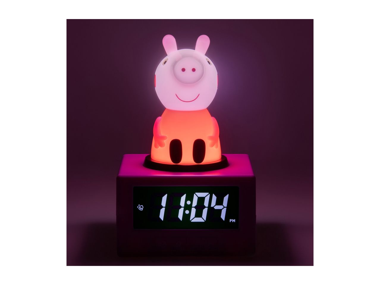 Pink pig-shaped night light and alarm clock displaying 1:04 PM.