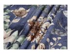 Blue fabric with a floral pattern featuring brown, beige, and green flowers and leaves.