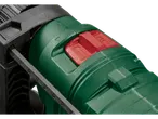 Mașină de găurit cu percuție verde și neagră, cu un buton roșu și o riglă de adâncime.