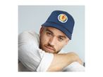 Man wearing a navy blue baseball cap with a circular Scotland crest, light shirt.