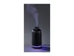 Black ribbed essential oil diffuser emitting purple-lit mist