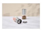 Two spice grinders, one with pink salt and one with mixed peppercorns, on a white surface.