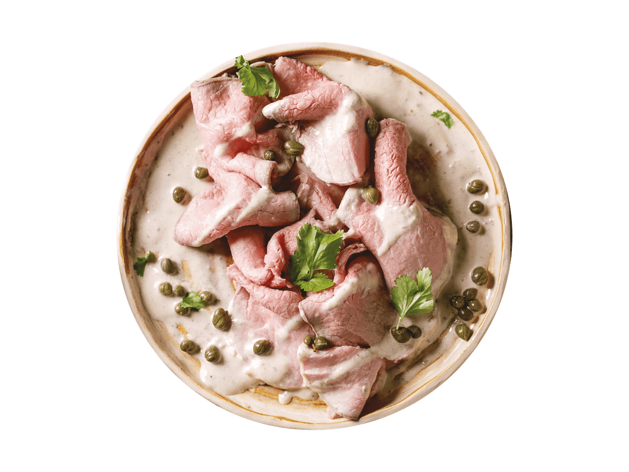 Vitello Tonnato mit Kapern und Petersilie auf einem Teller