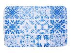 Blue and white patterned placemat with a Portuguese tile design.