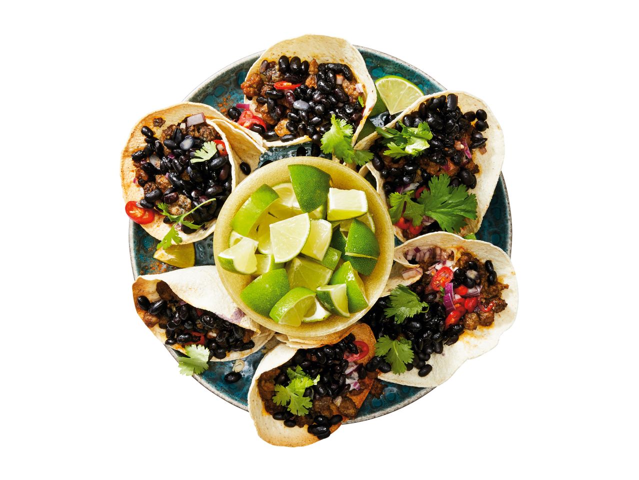 A plate of delicious-looking tacos with black beans and a side of pico de gallo.