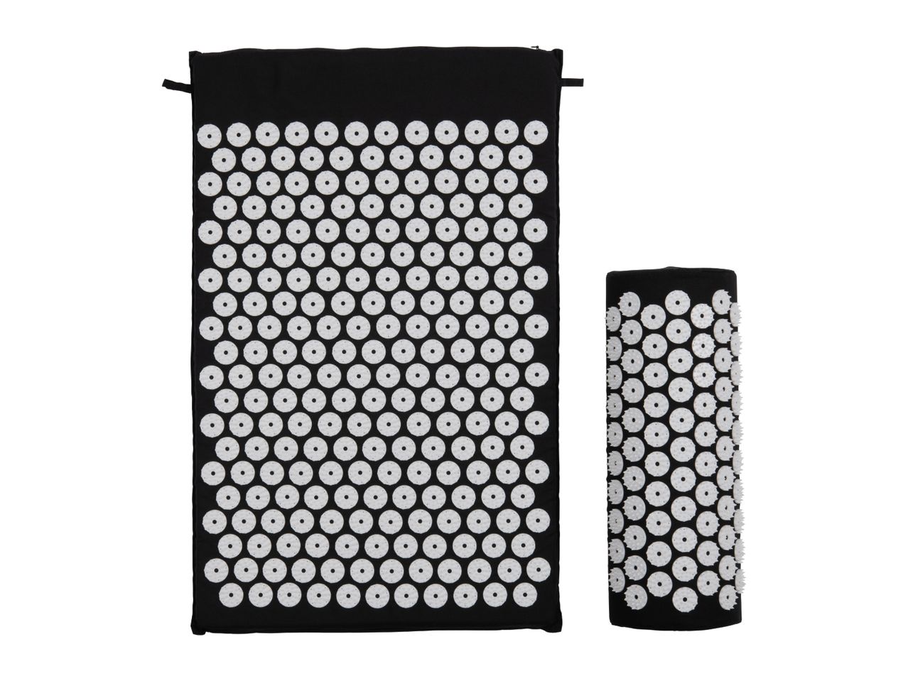 Black acupressure mat and a rolled-up acupressure pillow