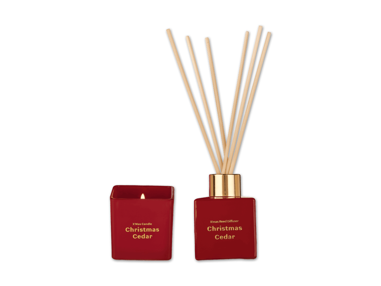 Rote Weihnachts-Duftkerze und Reed-Diffusor mit der Aufschrift „Christmas Cedar“.