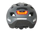Rear view of a gray bicycle helmet with an integrated red LED light and reflective strips.