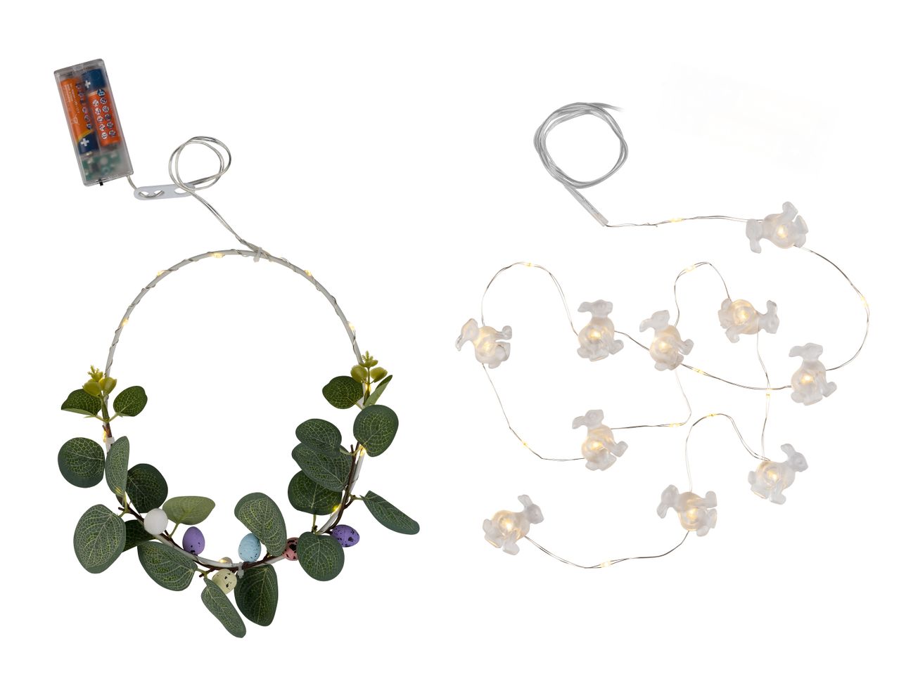 Osterkranz mit Blättern und Eiern, daneben eine Lichterkette mit Hasenfiguren.