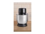 A black and silver kitchen machine with a mixing bowl on a wooden counter.