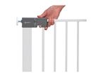 A hand operating the latch of a white Safety 1st baby gate.
