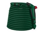 Coiled green garden hose with a spray gun and connector attachments.