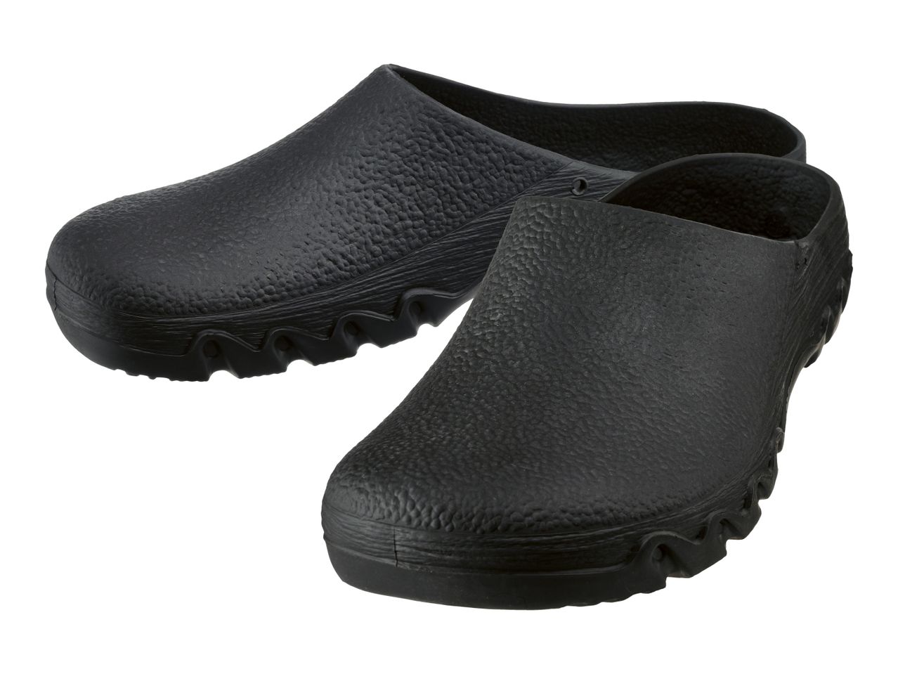 Pair of black slip-on clogs with textured surface and wavy soles.