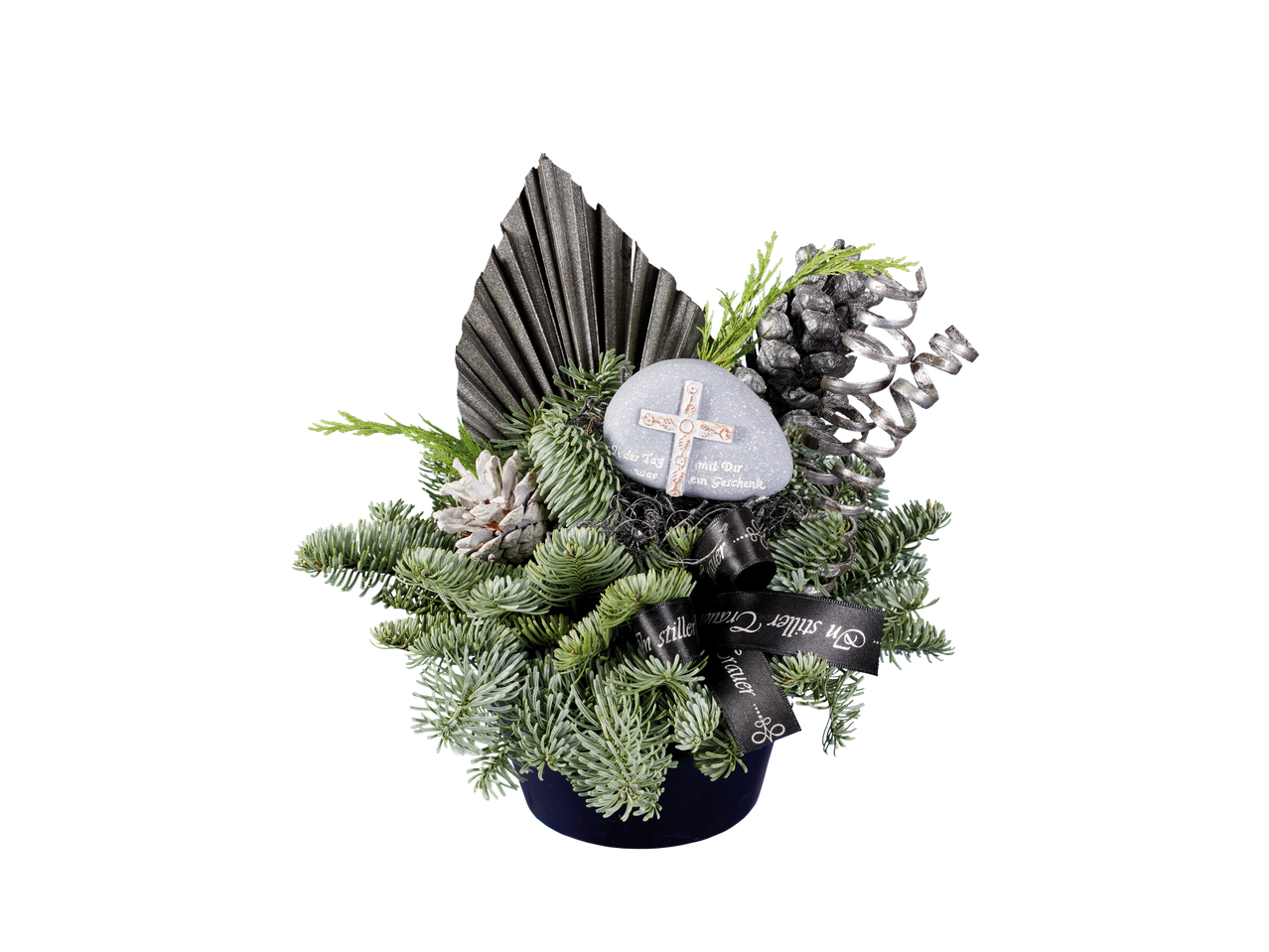 Funeral arrangement featuring fir branches, pinecones, and a decorative cross.