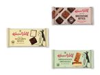Tre pakker bidestørrelse kager: brownie bites, mazarin bites og drømmekage.