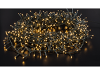 Warm white LED string lights, coiled on a dark surface.