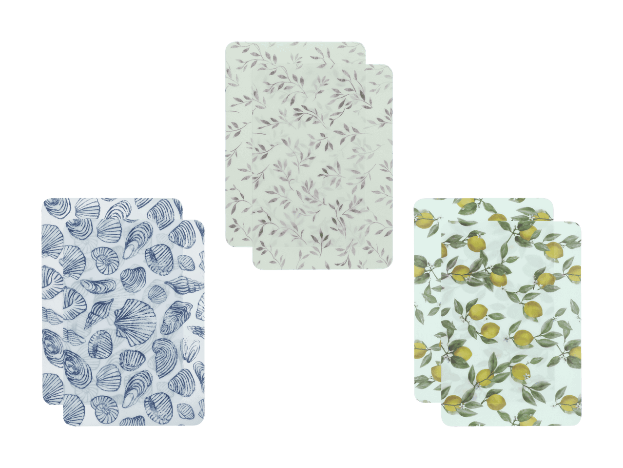 Drei Sets von zwei Schneidebrettern mit Muschel-, Blatt- und Zitronenmustern.