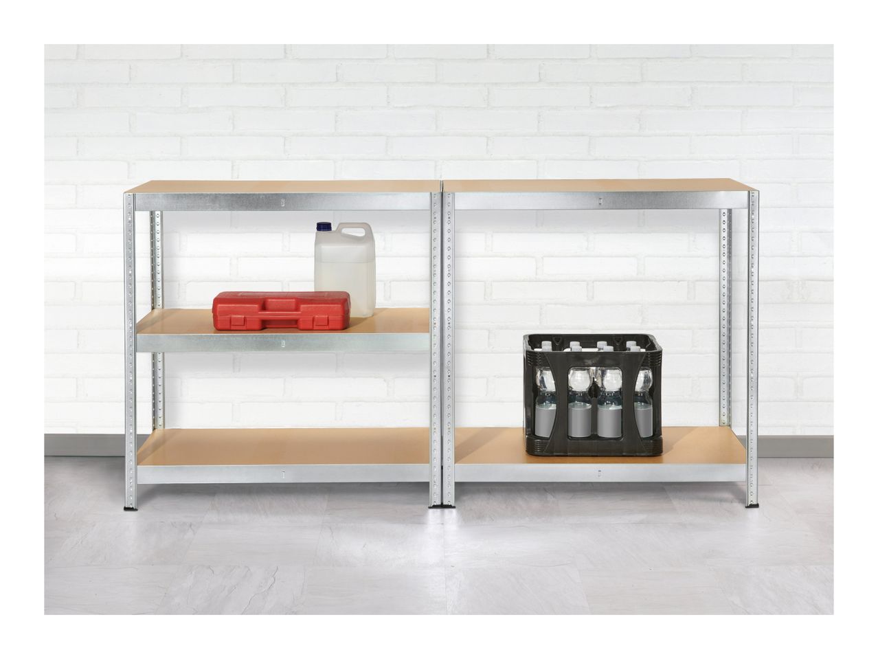 Two metal shelving units with a red toolbox, a white jug, and a crate of bottles.