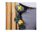 Cordless impact driver with a battery pack attached to a person's belt