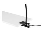 A black clamp-on lamp with a flexible arm attached to a white surface.