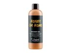 Shower gel bottle with 'Honey I'm Home' label, scented with honey, peach, and orange oil.