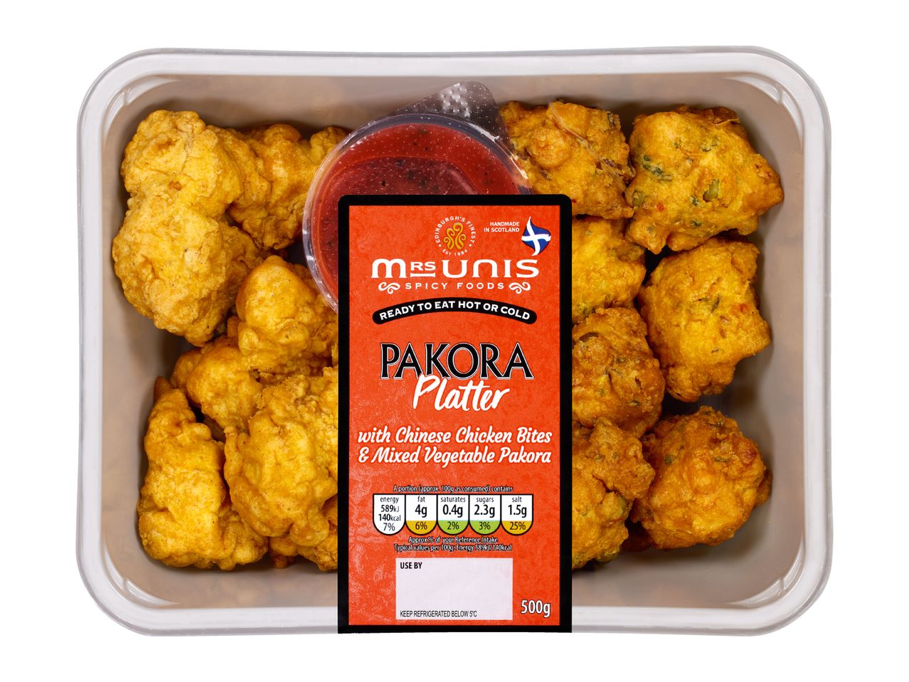 Pakora platter with Chinese chicken bites and mixed vegetable pakora, with a dipping sauce.