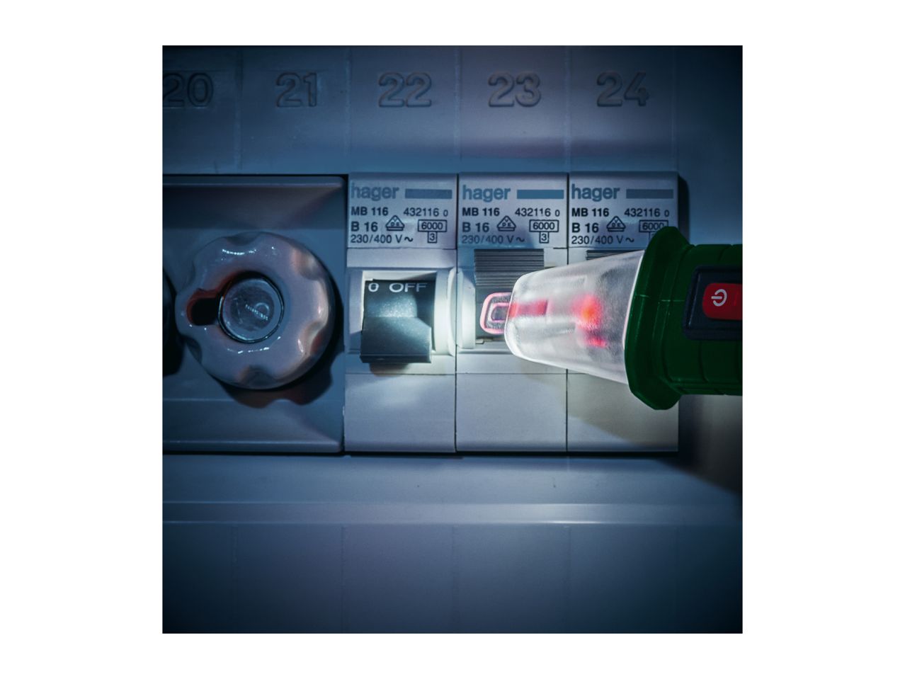 A voltage tester checking a circuit breaker in an electrical panel.