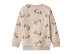 Beige long-sleeved sweatshirt with a pattern of cartoon dog faces.