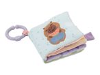 Soft baby activity book with a brown animal holding a watermelon, attached to a purple teether ring.
