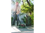 Outdoor cleaning with Parkside pressure washer and rotating brush.