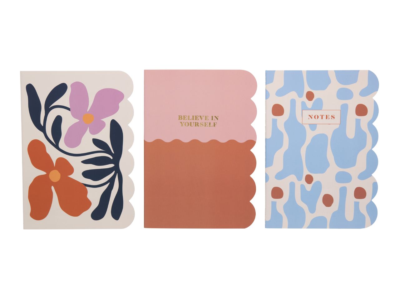 Three notebooks with scalloped edges: one with floral art, one with 'BELIEVE IN YOURSELF', and one with 'NOTES'.