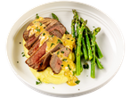 Sliced beef medallions with sauce, mashed potatoes, and asparagus on a white plate.