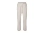 Beige pleated trousers.