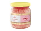 Jar of sliced, coloured, and pickled Japanese style ginger with a yellow lid.