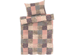 Ružičasti i ljubičasti patchwork posteljina s jastucima.