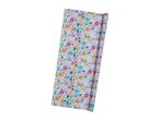 A roll of floral-patterned wrapping paper with a predominantly white background and colorful flowers.