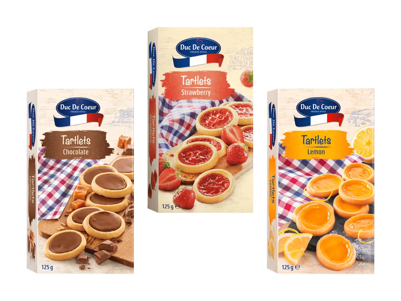 Trois paquets de tartelettes Duc De Coeur : chocolat, fraise et citron.